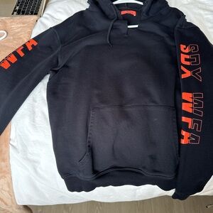 White Fox Boutique Black Hoodie Sweater with Red Graphic Sleeves